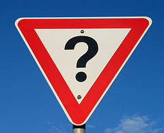 warning road sign with question