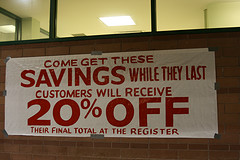 sign saving 20 per cent off - example discount