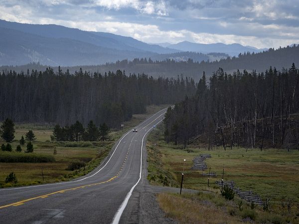 Open highway through mountain forest in Idaho