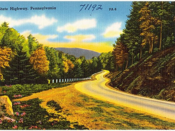 Vintage postcard of a state highway curving through Pennsylvania hills
