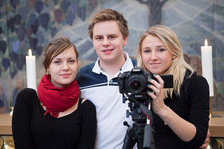 three teens taking picture